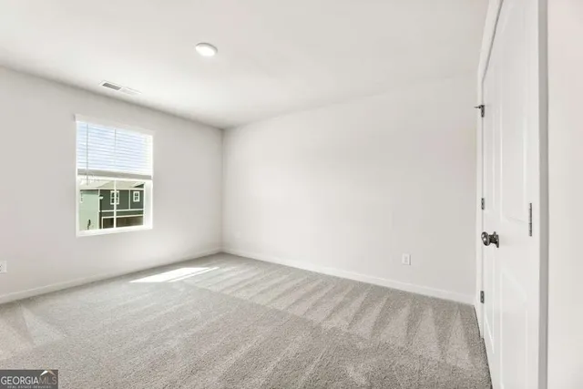 a bathroom with a granite countertop toilet a sink and a bathtub