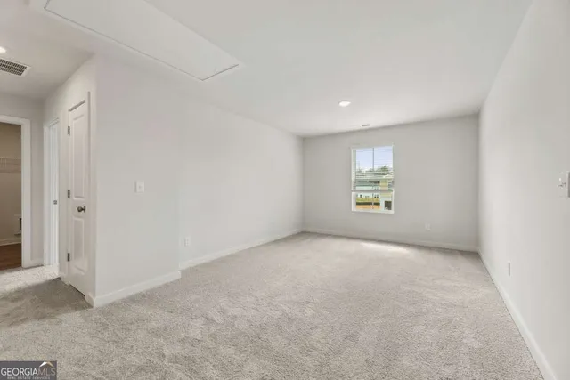 a view of a livingroom and a bathroom