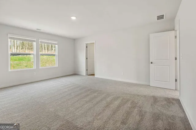 a bathroom with a double vanity sink mirror and shower