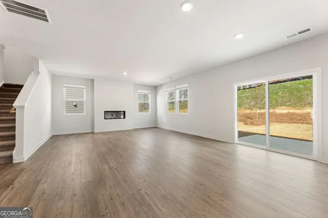 a view of a kitchen with a sink and a refrigerator
