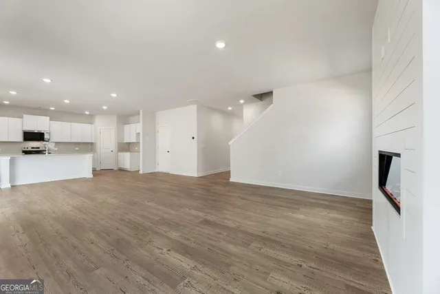 a view of kitchen with wooden floor