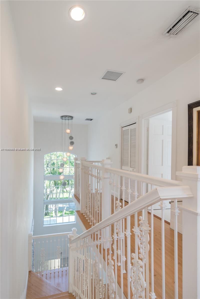 325 Pacific Road Key Biscayne, FL 33149 - Photo 14 of 31 a view of entryway with wooden floor