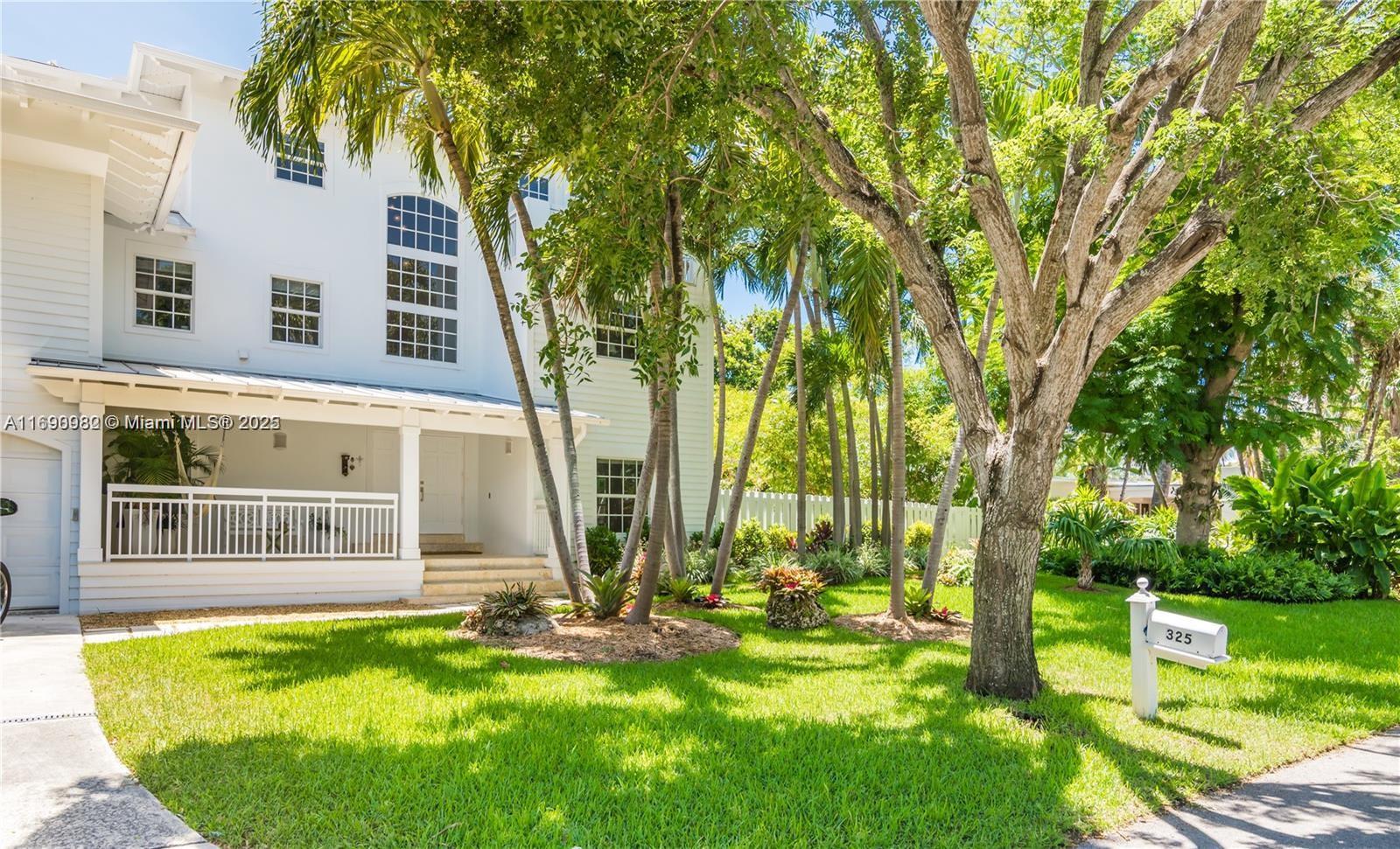 325 Pacific Road Key Biscayne, FL 33149 - Photo 2 of 31 front view of a house with a yard