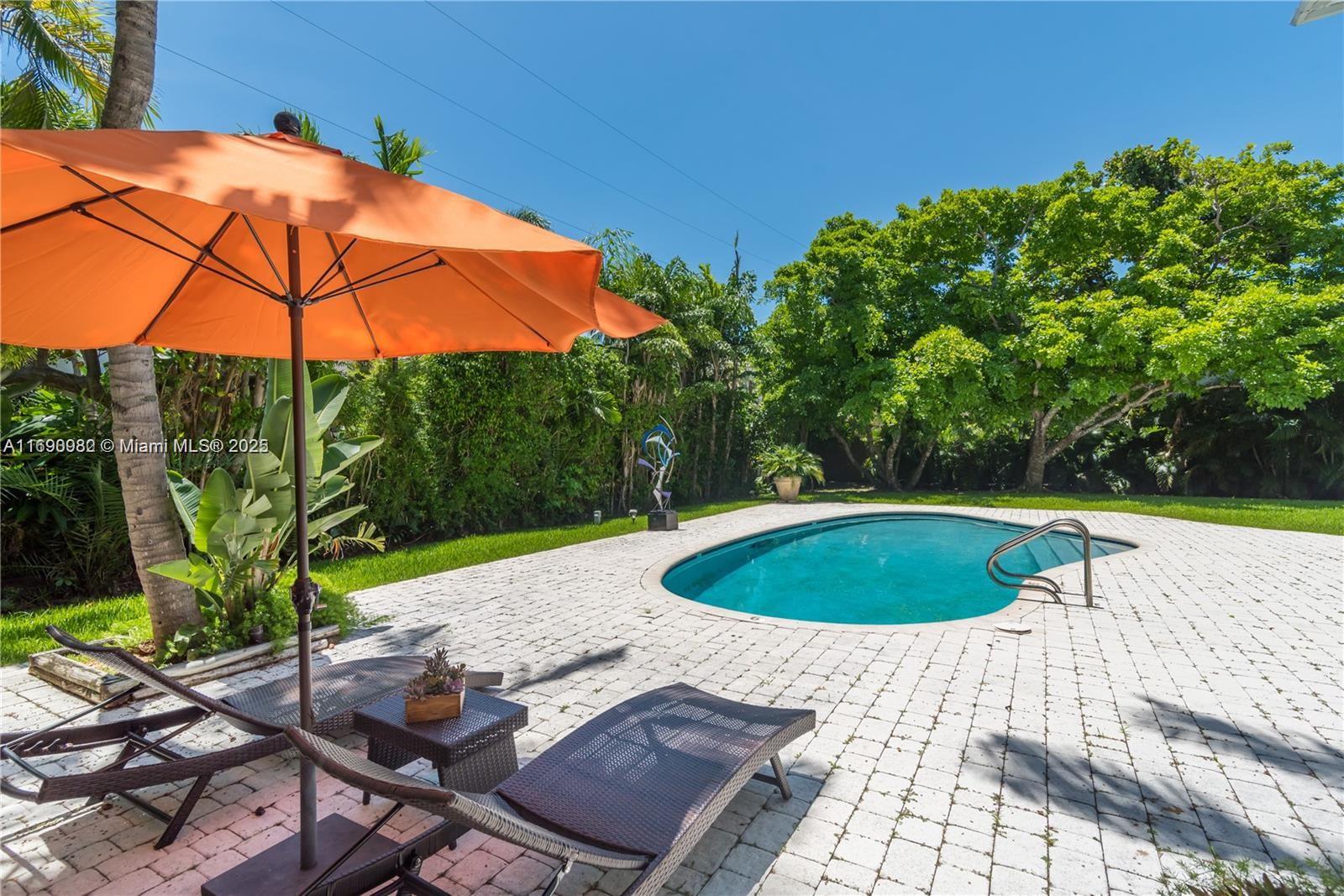 325 Pacific Road Key Biscayne, FL 33149 - Photo 26 of 31 a view of outdoor space and swimming pool