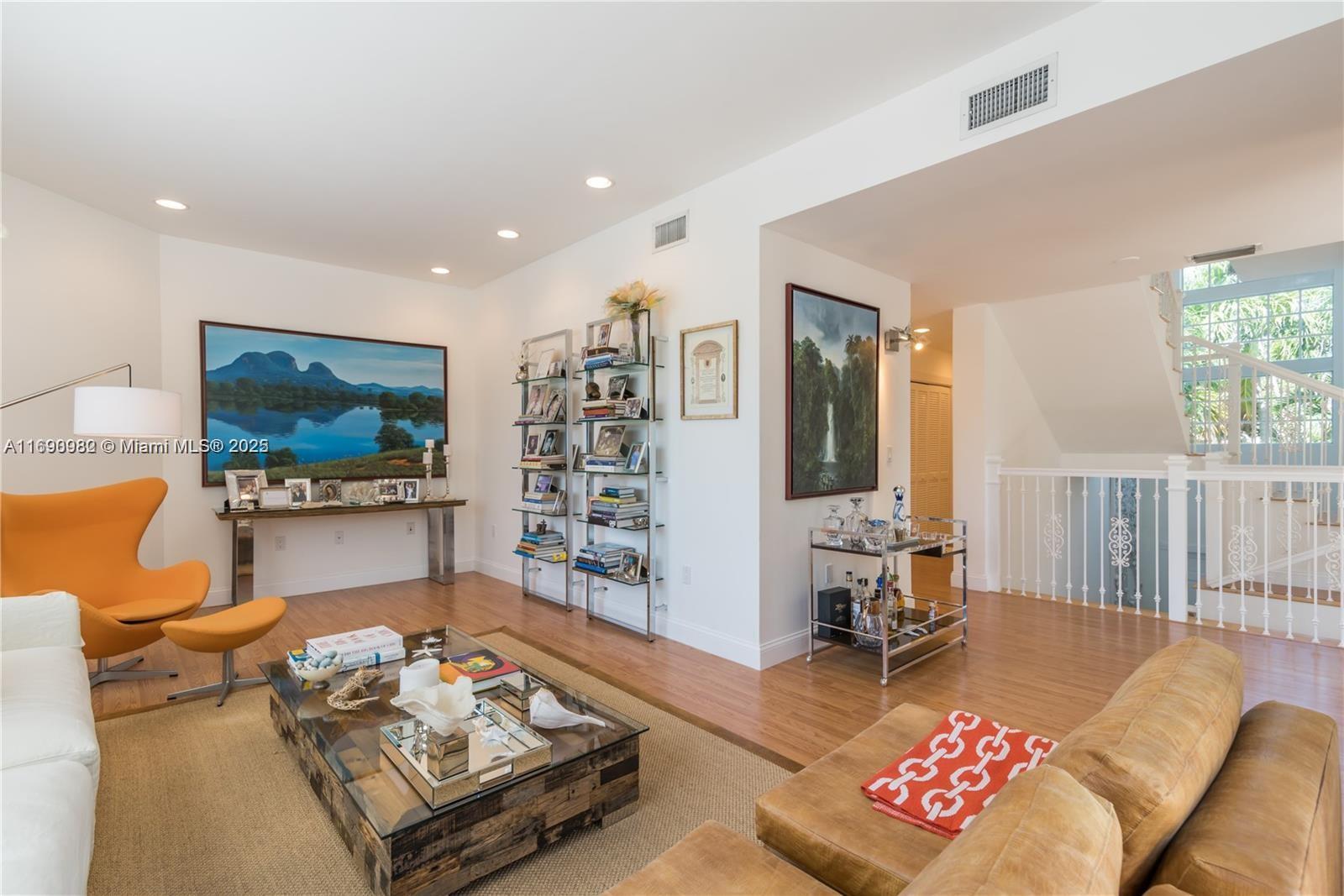 325 Pacific Road Key Biscayne, FL 33149 - Photo 5 of 31 a living room with furniture and a flat screen tv