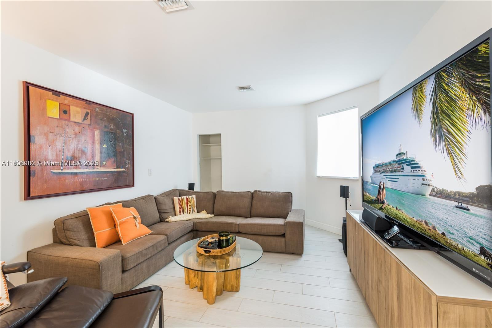 325 Pacific Road Key Biscayne, FL 33149 - Photo 6 of 31 a living room with furniture and a wooden floor