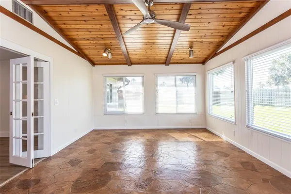 a view of empty room with windows