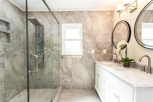 a bathroom with a sink and a mirror