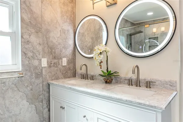 a bathroom with a sink and a mirror