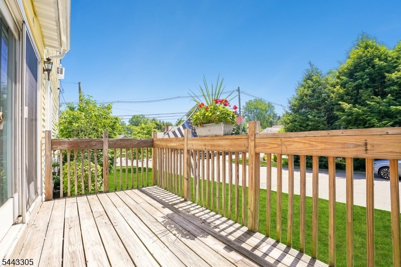 267 Kings Road Madison, NJ 07940 - Photo 22 of 37 a view of a wooden roof deck