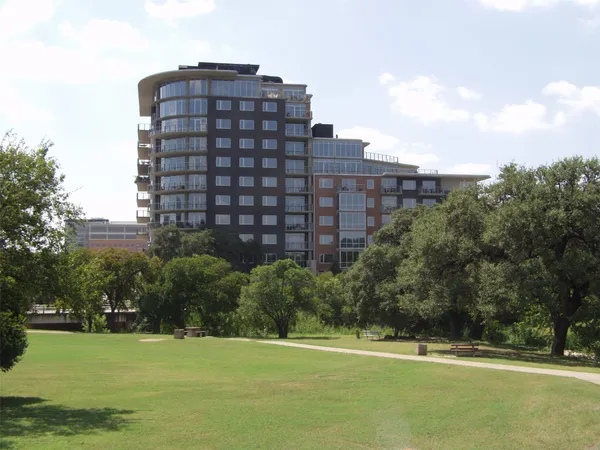 a view of a large building with a yard