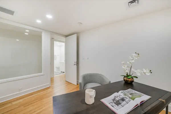 a living room with furniture and next to a window