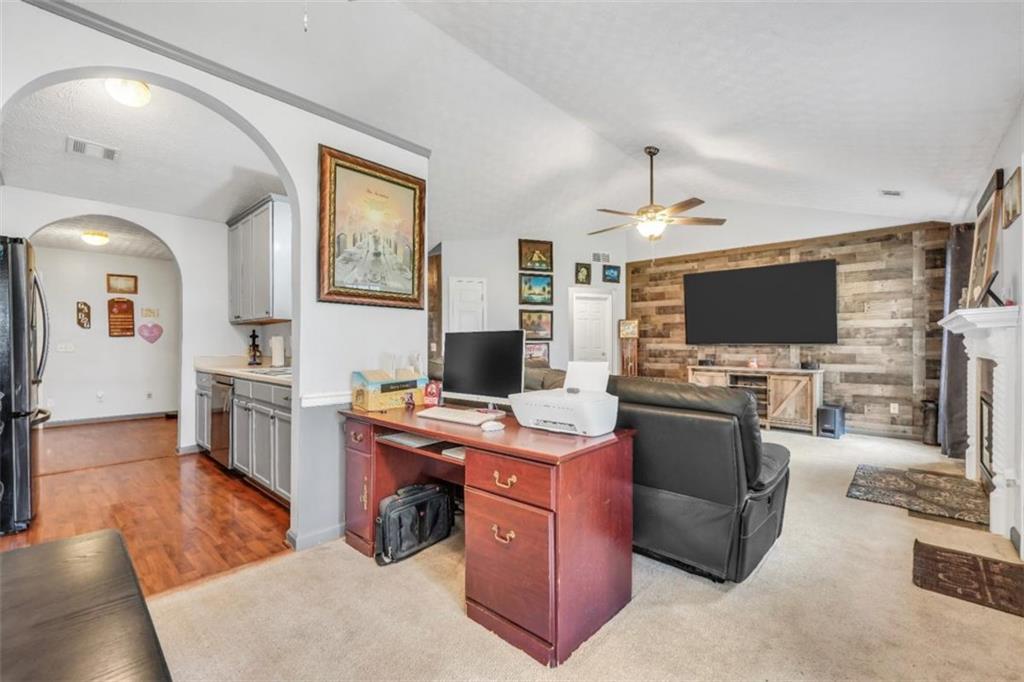 15 Tara Way Covington, GA 30016 - Photo 12 of 40 a living room with furniture and a flat screen tv