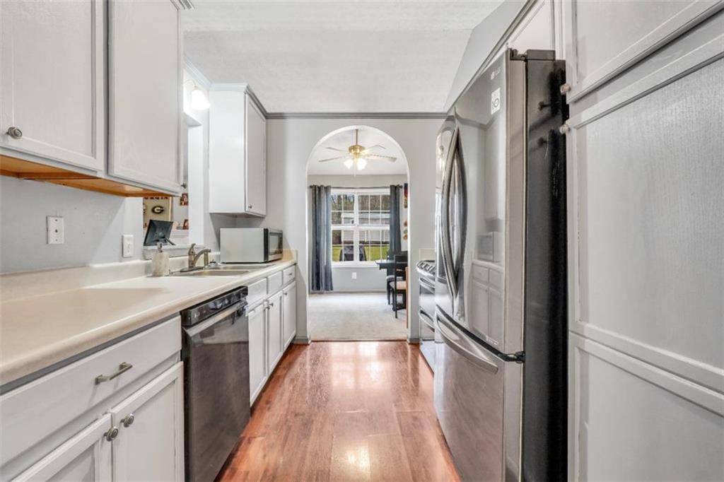 15 Tara Way Covington, GA 30016 - Photo 17 of 40 a large kitchen with a lot of counter space and wooden floor