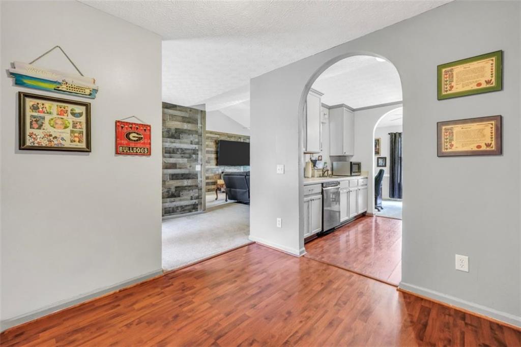 15 Tara Way Covington, GA 30016 - Photo 18 of 40 a view of a living room with furniture and wooden floor