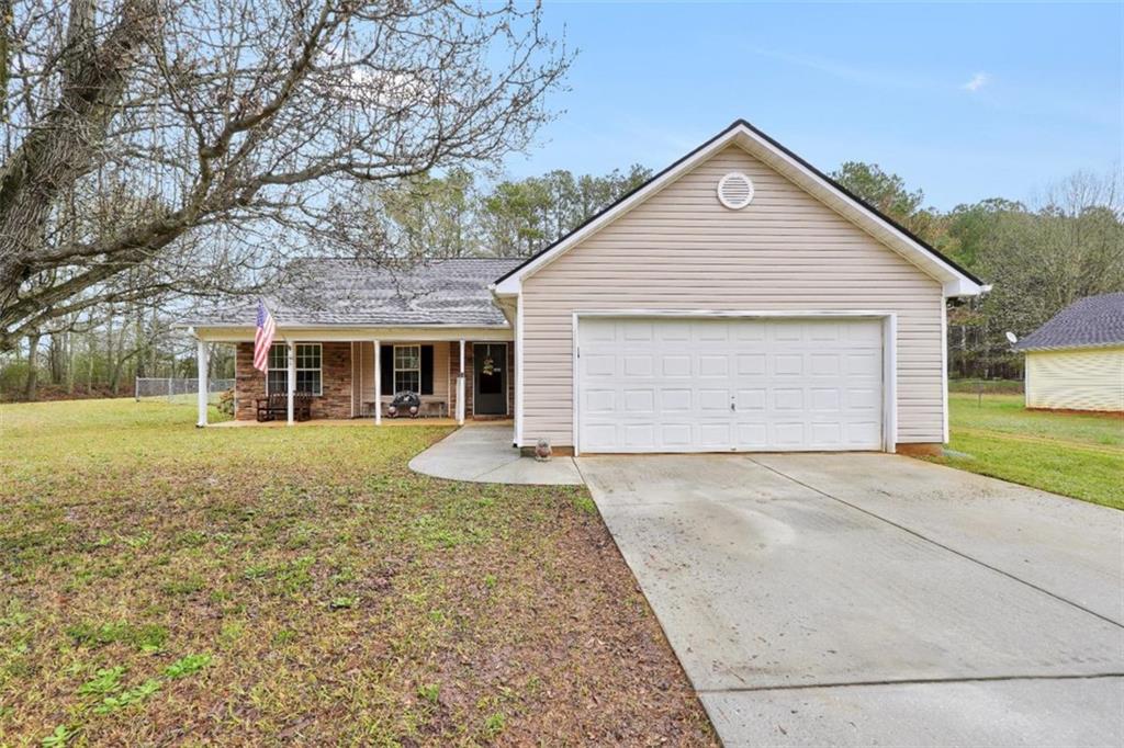 15 Tara Way Covington, GA 30016 - Photo 2 of 40 front view of a house with a yard