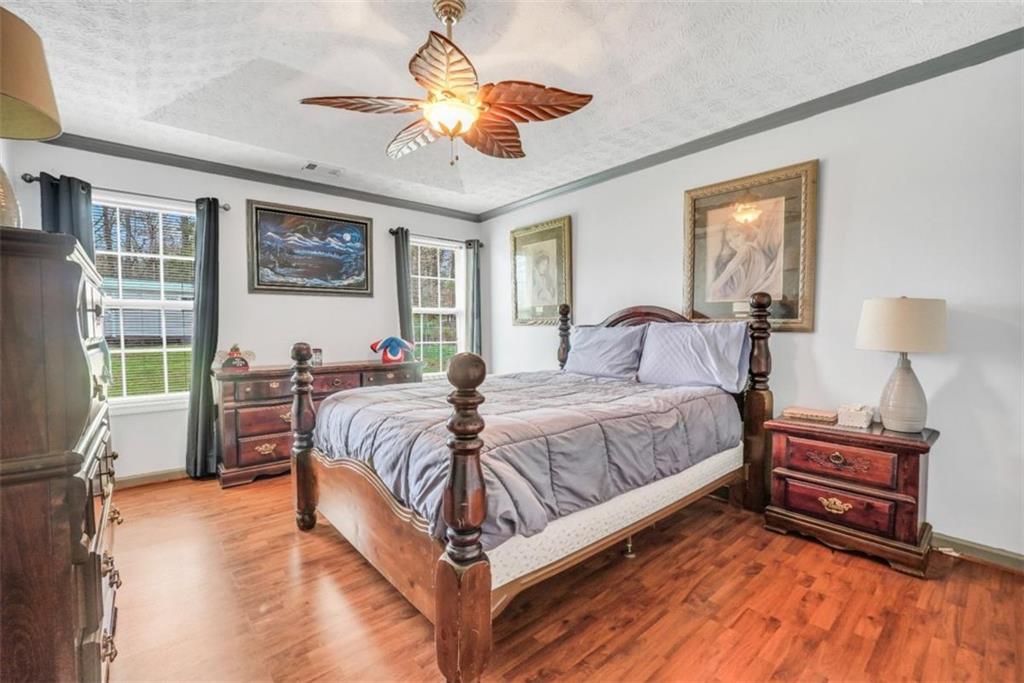 15 Tara Way Covington, GA 30016 - Photo 21 of 40 a spacious bedroom with a bed and a large window