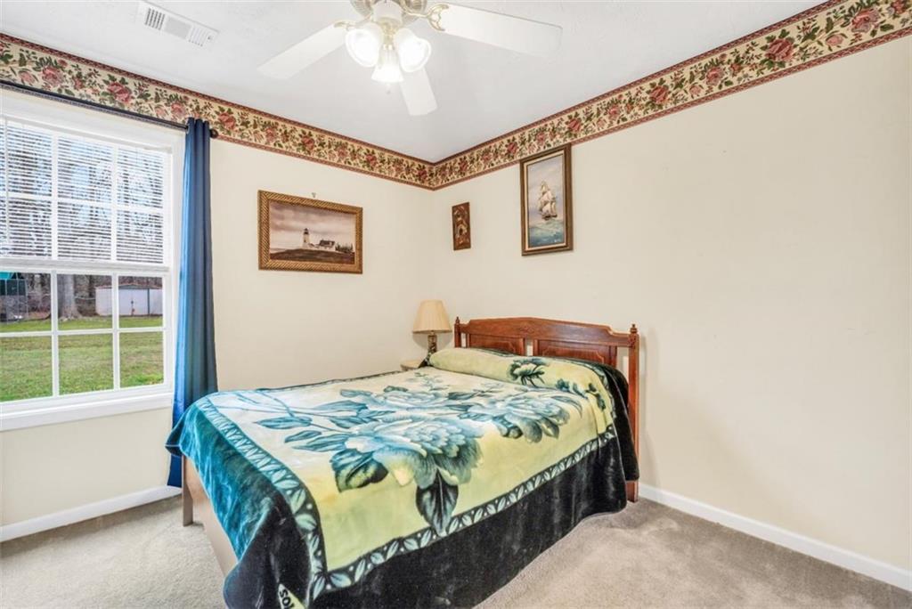 15 Tara Way Covington, GA 30016 - Photo 27 of 40 a bedroom with a bed and a window