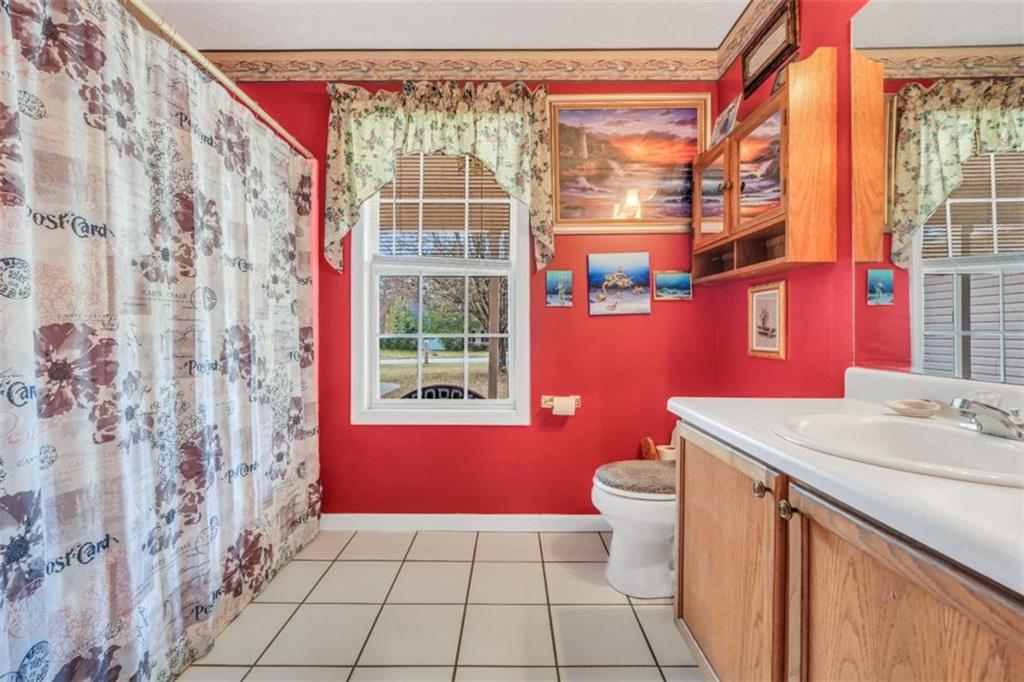 15 Tara Way Covington, GA 30016 - Photo 28 of 40 a bathroom with a sink toilet and shower