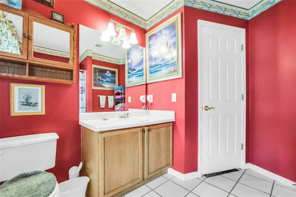 15 Tara Way Covington, GA 30016 - Photo 30 of 40 a bathroom with a sink a toilet and a window