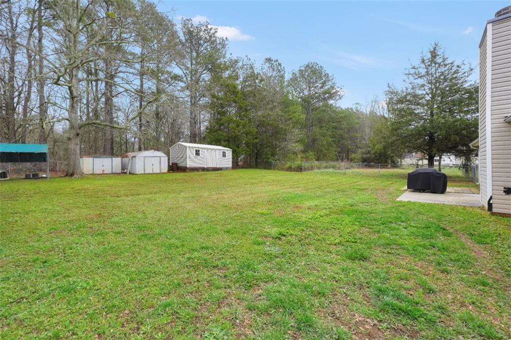15 Tara Way Covington, GA 30016 - Photo 35 of 40 a view of a field of grass and trees