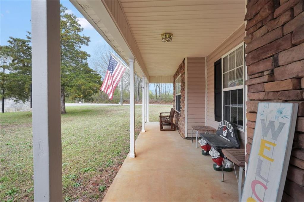 15 Tara Way Covington, GA 30016 - Photo 6 of 40 a view of a porch with chairs and backyard