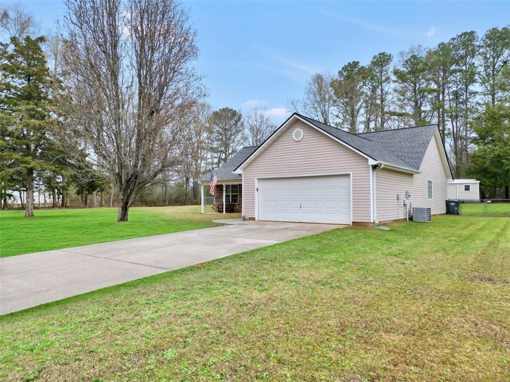 15 Tara Way Covington, GA 30016 - Photo 7 of 40 a view of a house with backyard and garden