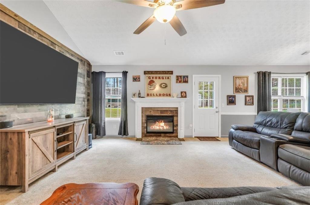 15 Tara Way Covington, GA 30016 - Photo 10 of 40 a living room with furniture and a fireplace