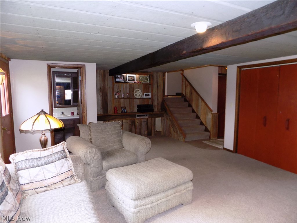 7676 Diagonal Road Kent, OH 44240 - Photo 22 of 35 Lots of storage to the right. I/2 flight up goes to right towards foyer, straight into kitchen. At base of steps is a ceramic landing to go into garage or down half flight to recreation room.