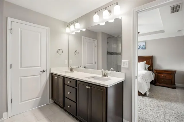 a spacious bathroom with a double vanity sink mirror and