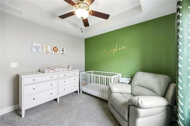 a bedroom with a bed and a couch