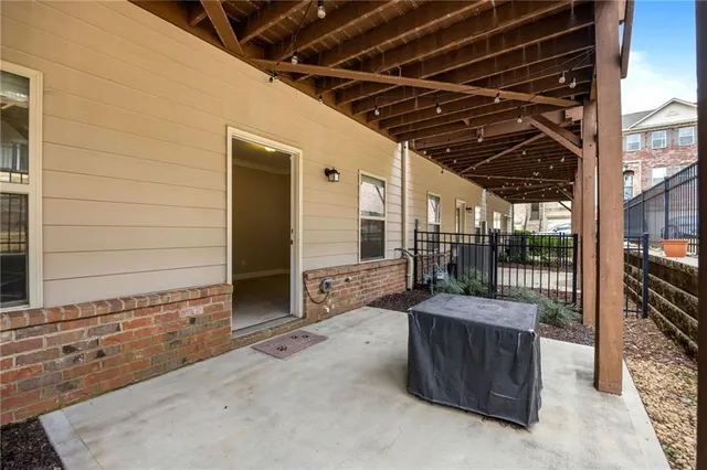 a view of a chairs and table in the balcony