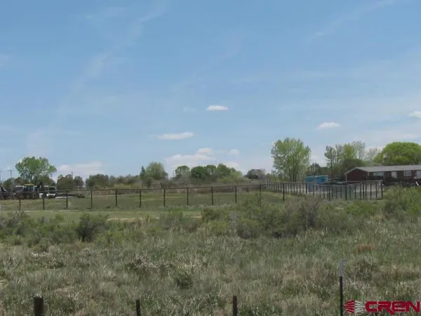 a view of a town with mountains in the background