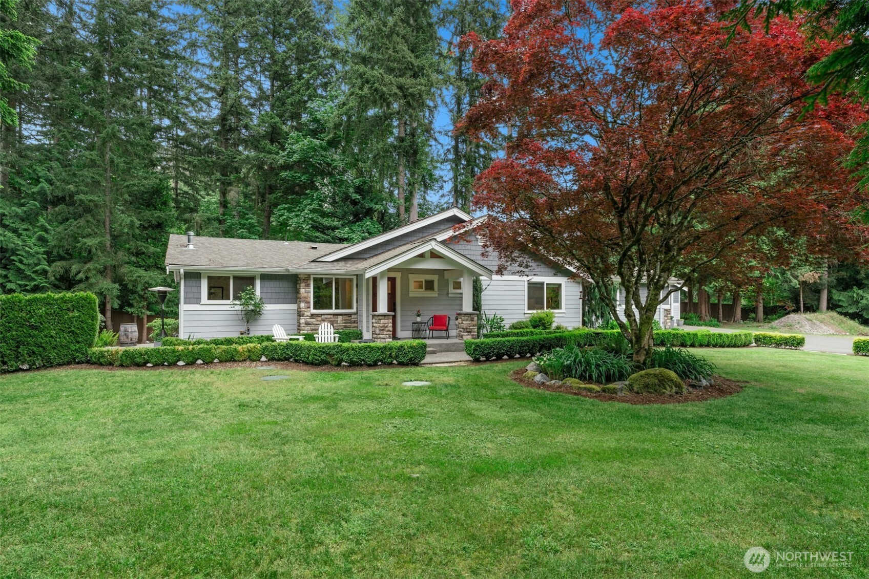 23307 49th Avenue Southeast Bothell, WA 98021 - Photo 1 of 37 a front view of a house with garden