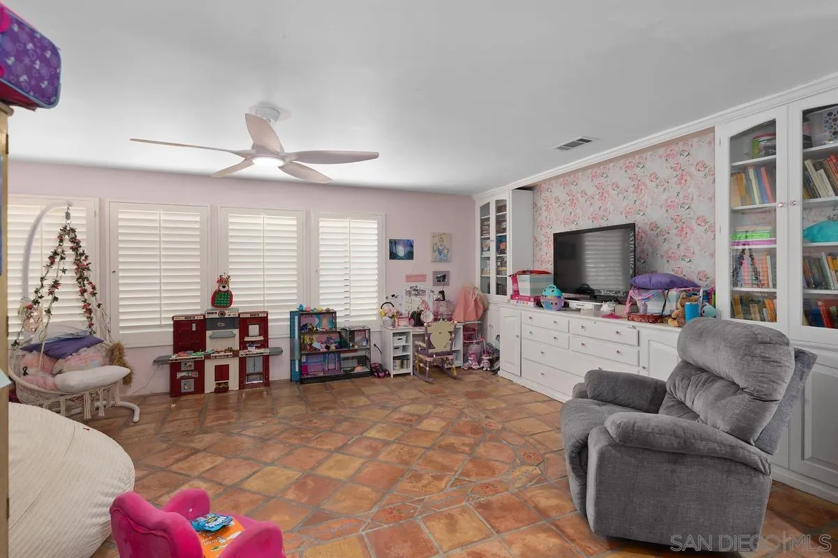 3245 Skytrail Ranch Road Jamul, CA 91935 - Photo 15 of 45 a living room with furniture and a flat screen tv