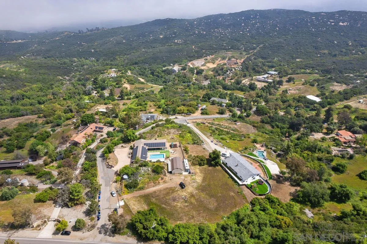 3245 Skytrail Ranch Road Jamul, CA 91935 - Photo 17 of 45 an aerial view of residential houses with outdoor space and trees
