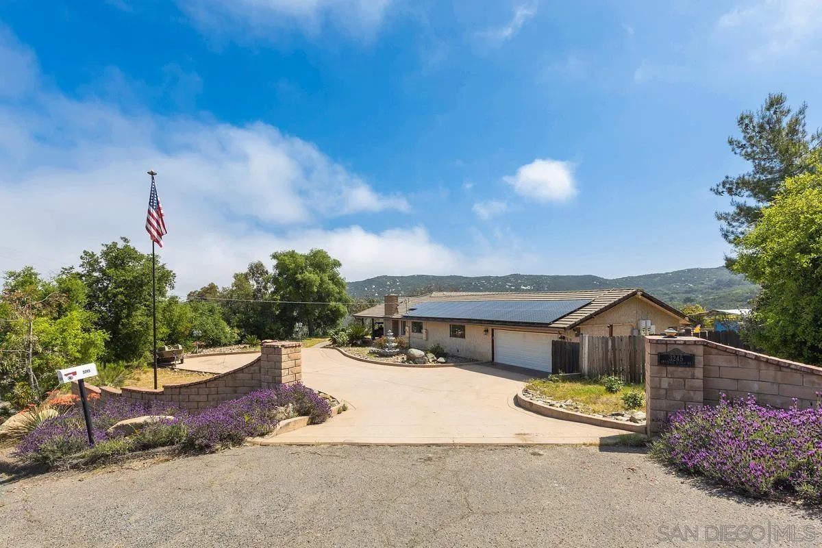 3245 Skytrail Ranch Road Jamul, CA 91935 - Photo 2 of 45 a front view of a house with a yard