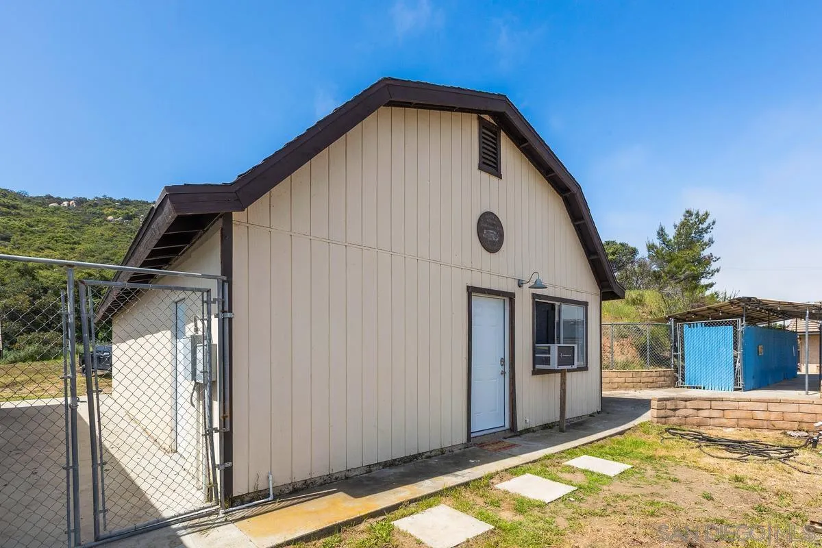 3245 Skytrail Ranch Road Jamul, CA 91935 - Photo 30 of 45 a view of house with backyard