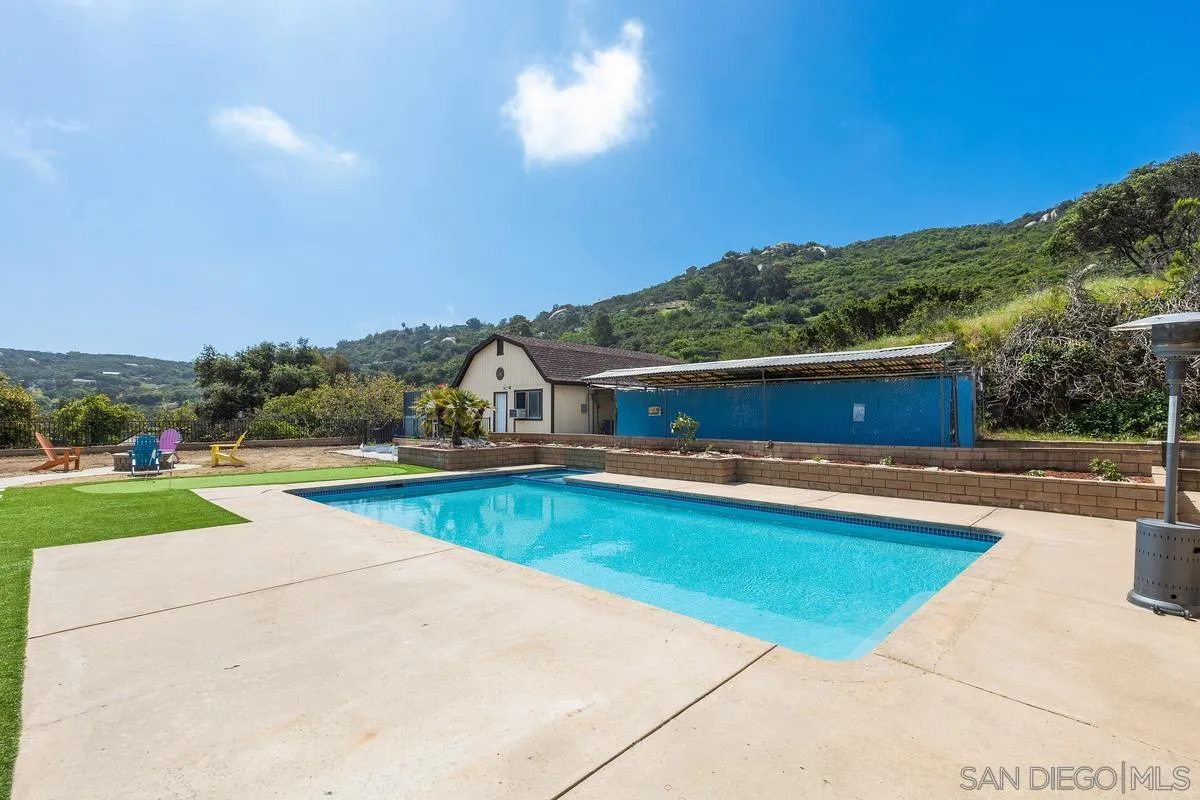 3245 Skytrail Ranch Road Jamul, CA 91935 - Photo 3 of 45 a view of a swimming pool and a yard