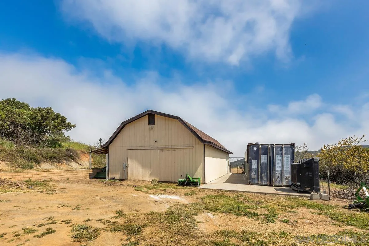 3245 Skytrail Ranch Road Jamul, CA 91935 - Photo 32 of 45 a view of a house with a yard