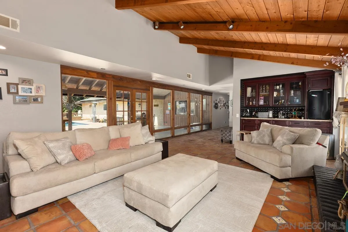 3245 Skytrail Ranch Road Jamul, CA 91935 - Photo 9 of 45 a living room with furniture and a large window