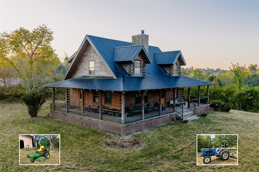 5991 Sandy Ridge Road Southeast Tippecanoe, OH 44699 - Photo 2 of 34 Front of house featuring covered porch, a metal roof, log exterior, a chimney, and a yard