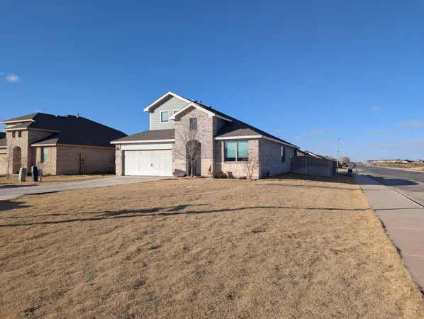 a kitchen with stainless steel appliances granite countertop a refrigerator and a stove