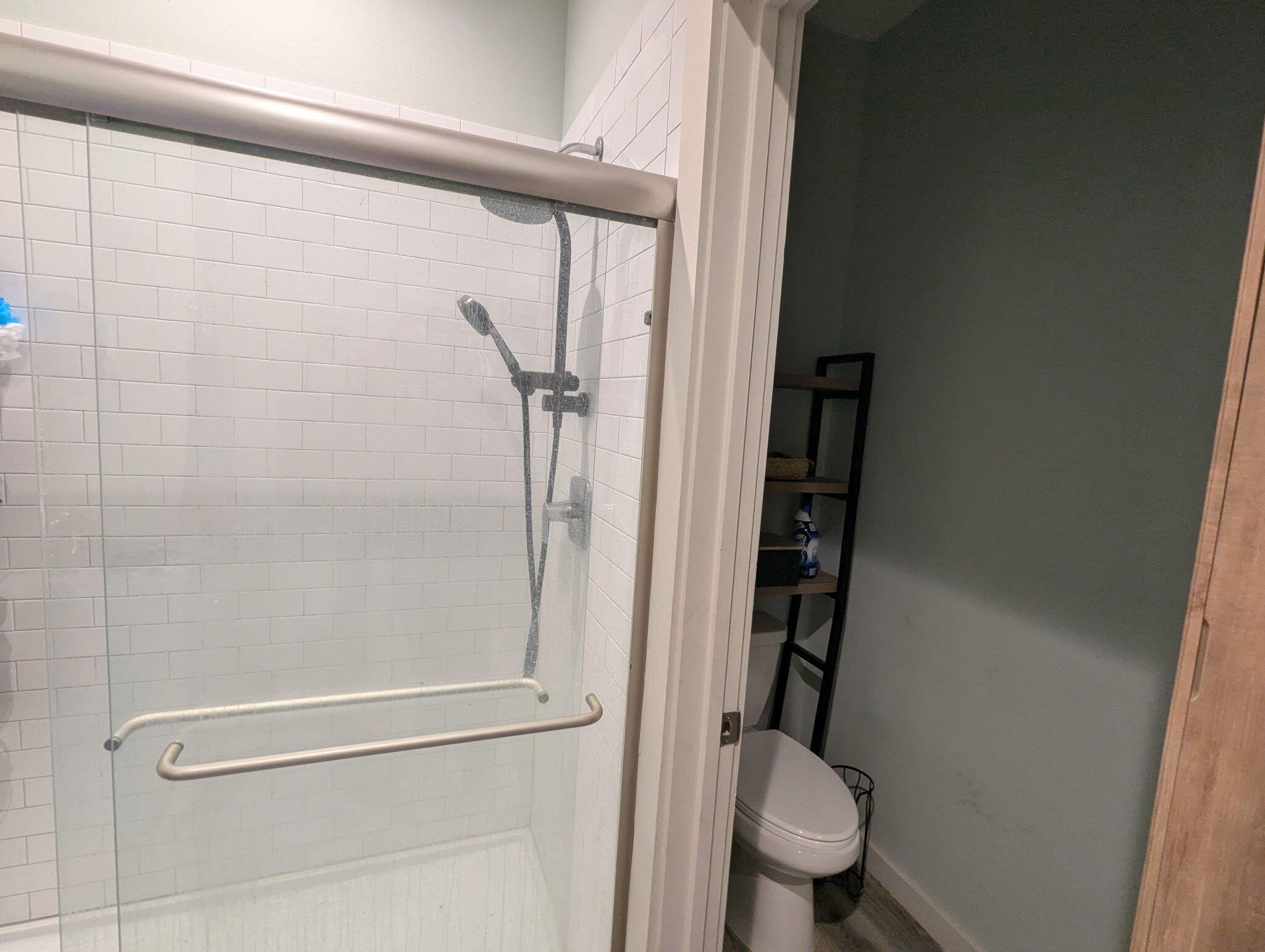 6802 55th Street Lubbock, TX 79407 - Photo 21 of 46 a bathroom with a granite countertop toilet and a shower