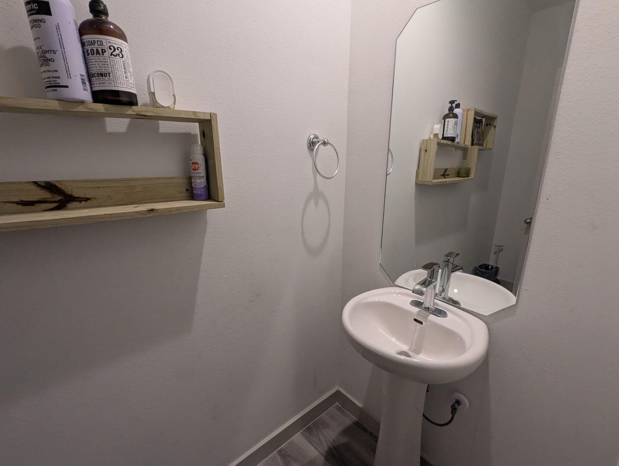 6802 55th Street Lubbock, TX 79407 - Photo 24 of 46 a bathroom with a sink and mirror