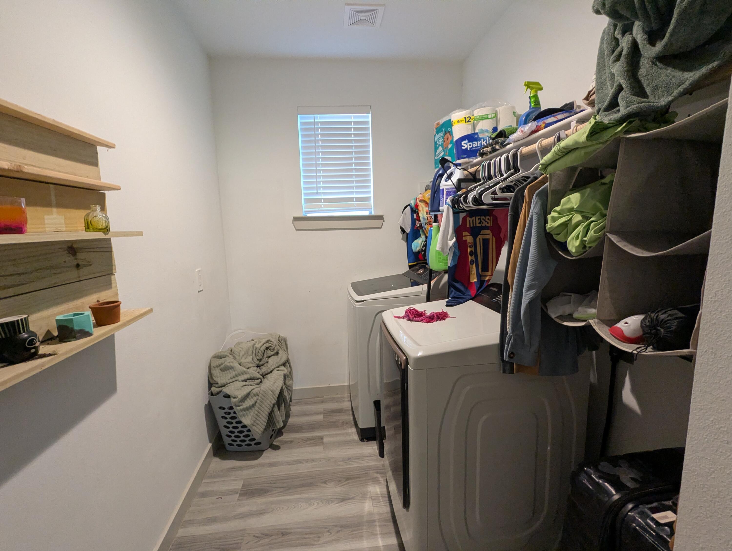 6802 55th Street Lubbock, TX 79407 - Photo 30 of 46 a view of walk in closet with clothes and shoes