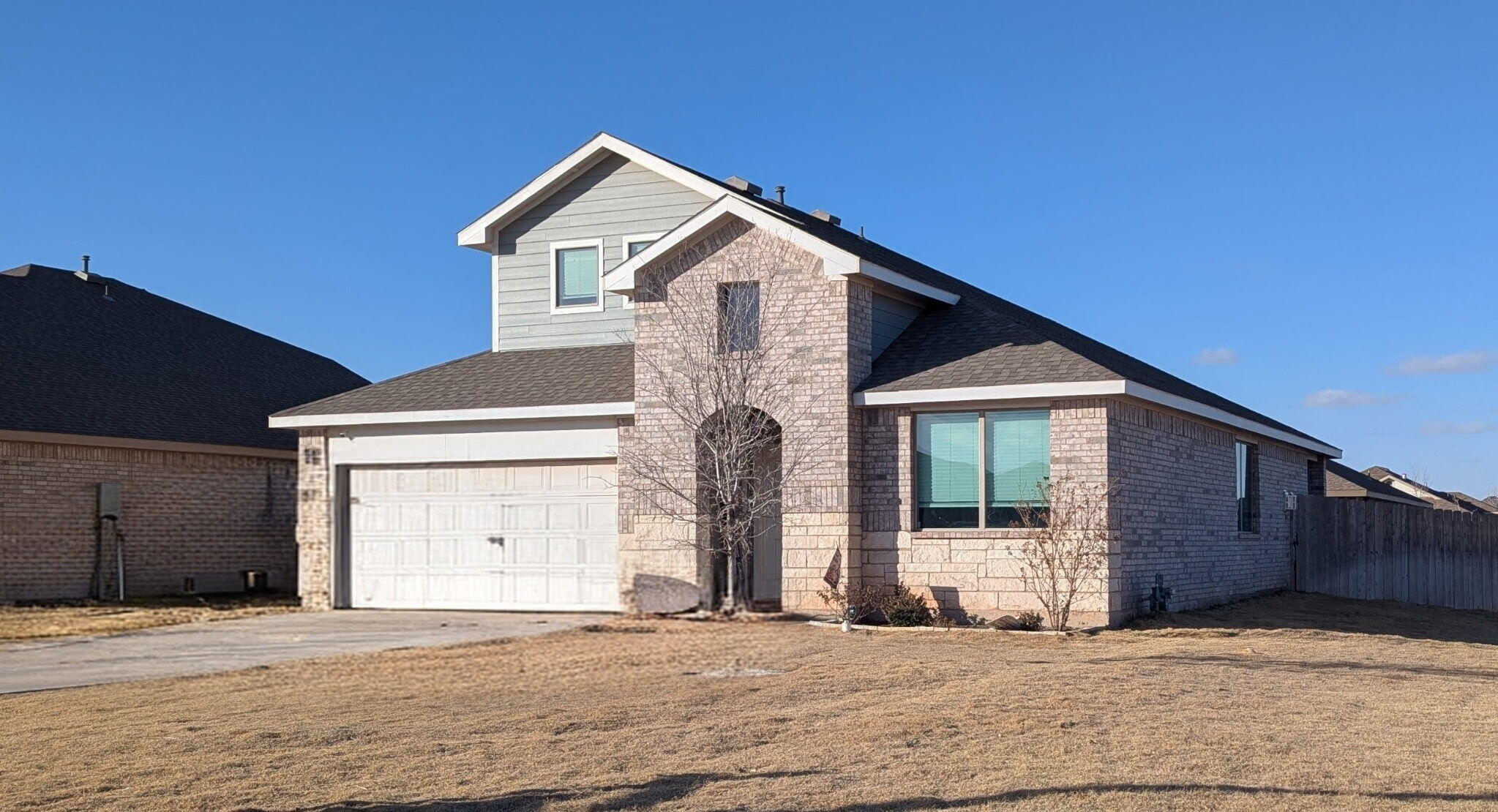 6802 55th Street Lubbock, TX 79407 - Photo 43 of 46 a front view of a house with a garage
