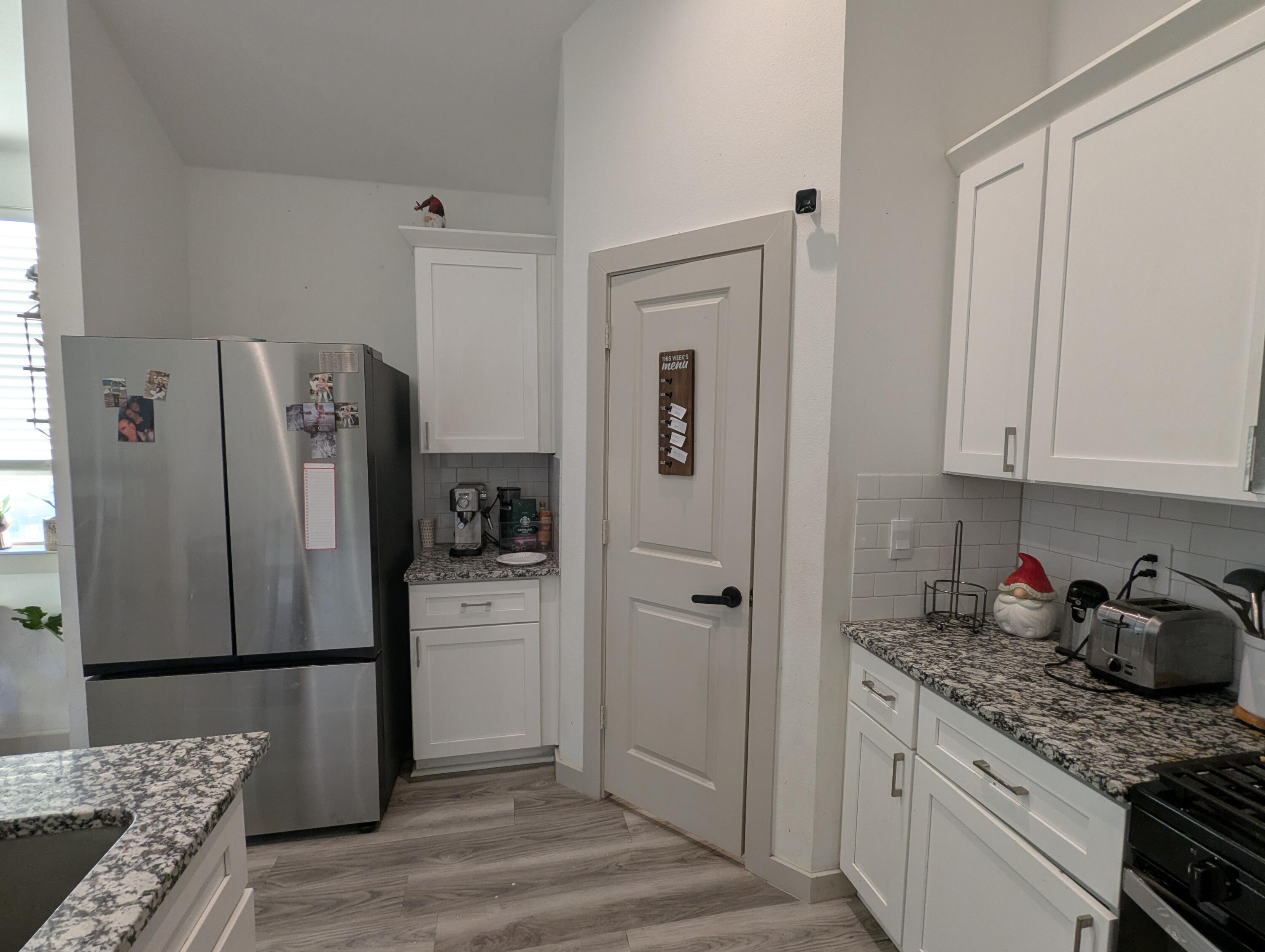 6802 55th Street Lubbock, TX 79407 - Photo 7 of 46 a kitchen with stainless steel appliances granite countertop a refrigerator and a stove