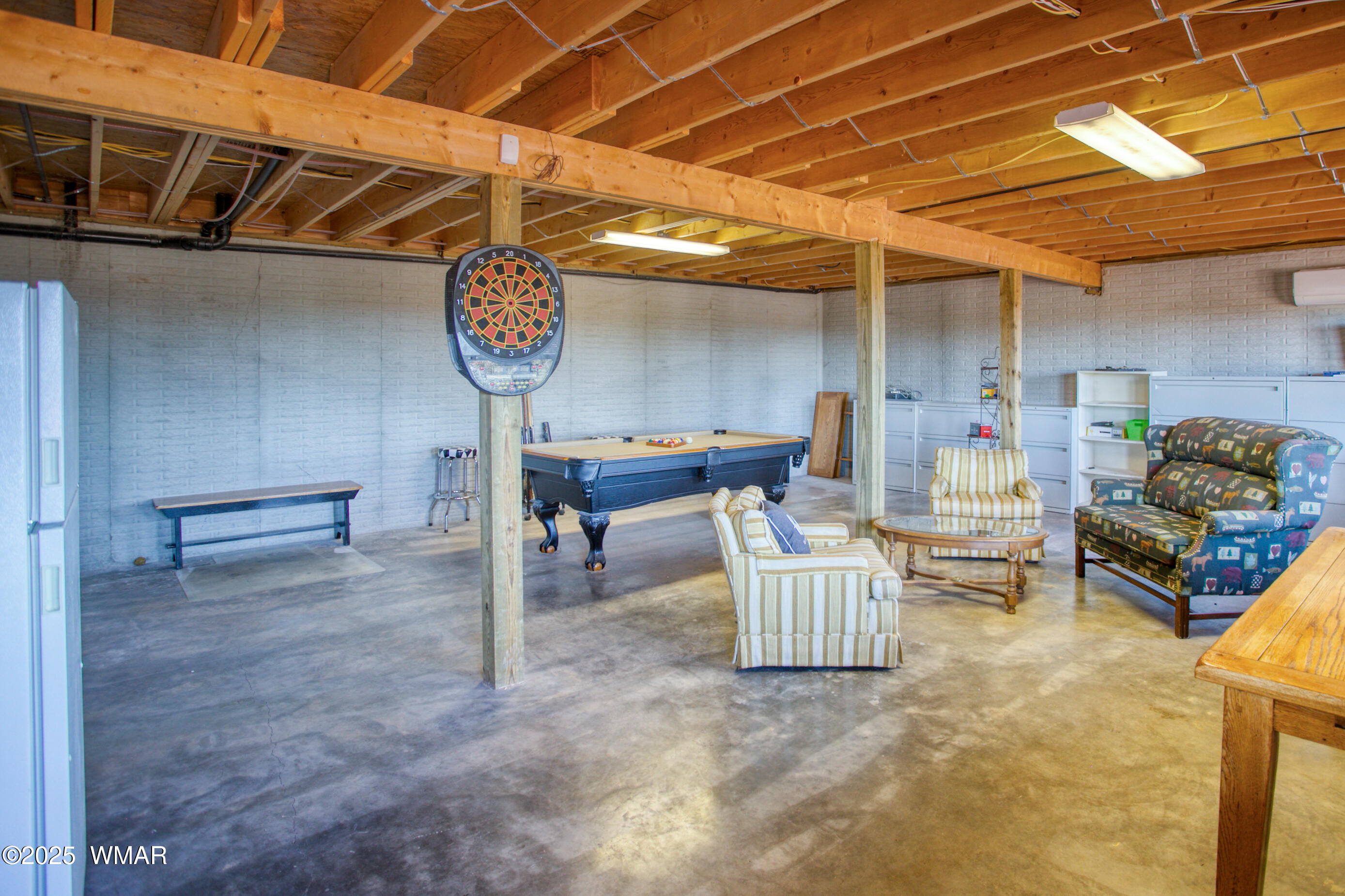 8555 Reata Lane Snowflake, AZ 85937 - Photo 39 of 88 a room with lots of furniture and a chandelier