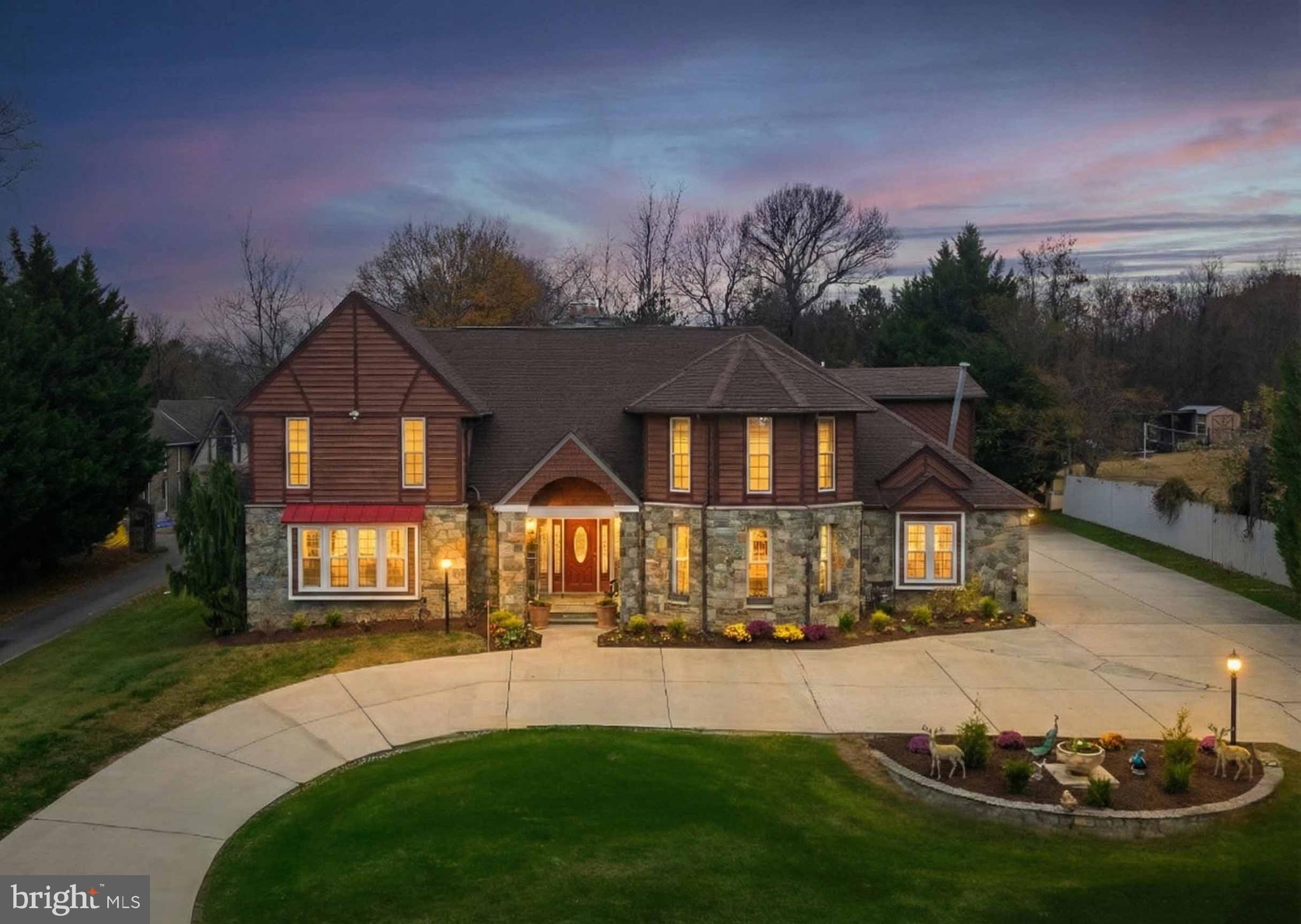 a front view of a house with a yard table and chairs